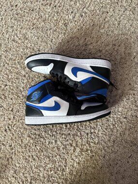 Im selling Mid cut Gym Blue, Black, White Jordan Retro 1's Size 10.5 !